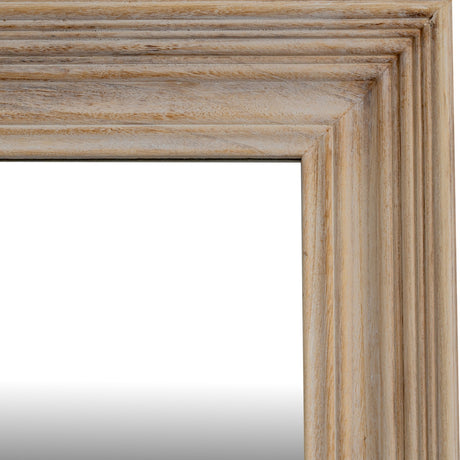 Close-up of the Hill Interiors Washed Wood Framed Wall Mirror in brown, showing the grain-forward timber corner and layered moulding of the surround.