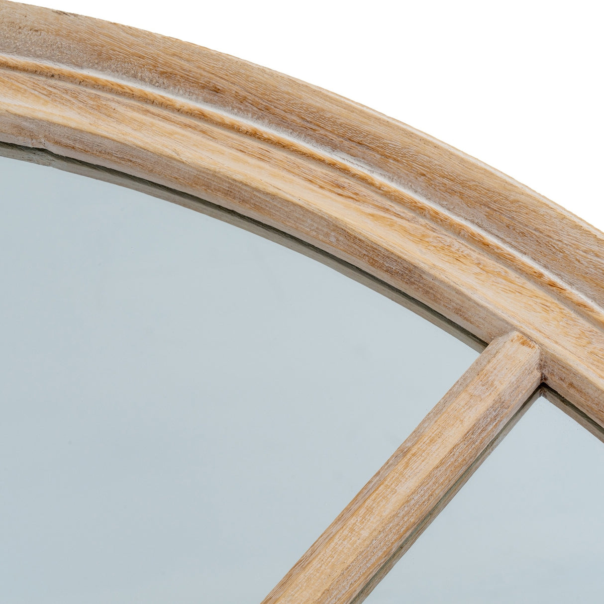 Close-up of the Hill Interiors Washed Wood Round Window Mirror in brown, showing the curved timber frame, visible grain, and cross bar dividing the glass panes.