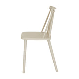 Side view of Hill Interiors Brolvanic Accent Chair in beige moulded plastic with spindle back and matte finish, on a plain white background.