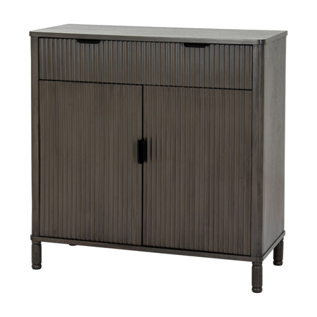 Hill Interiors Wooden Ribbed Two-Door Cabinet in brown, featuring a ribbed drawer above two ribbed doors with black handles on turned legs.