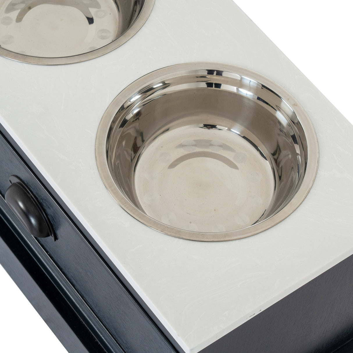 Close-up of the Hill Interiors Wooden Pet Feeder Table in black, showing a recessed stainless steel bowl set into the white top above a drawer.