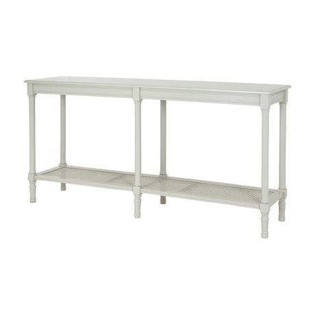 Hill Interiors Large Rattan Console Table in white with a solid wood frame, turned legs and a woven rattan lower shelf, on a plain background.