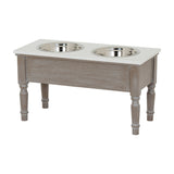 Hill Interiors Wooden Pet Feeder Table in grey with two stainless steel bowls set into a cream top, raised on turned wooden legs.