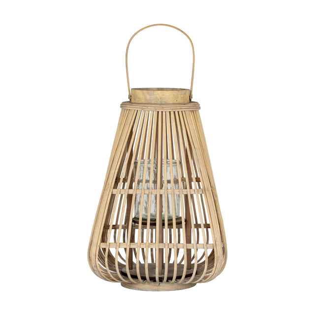 Hill Interiors Large Wicker Lantern in brown with tapered woven frame, arched handle and clear glass candle holder inside, on a plain background.