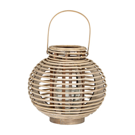 Hill Interiors large round willow lantern in warm brown with woven wicker frame, arched handle and removable glass candle holder, on a white background.