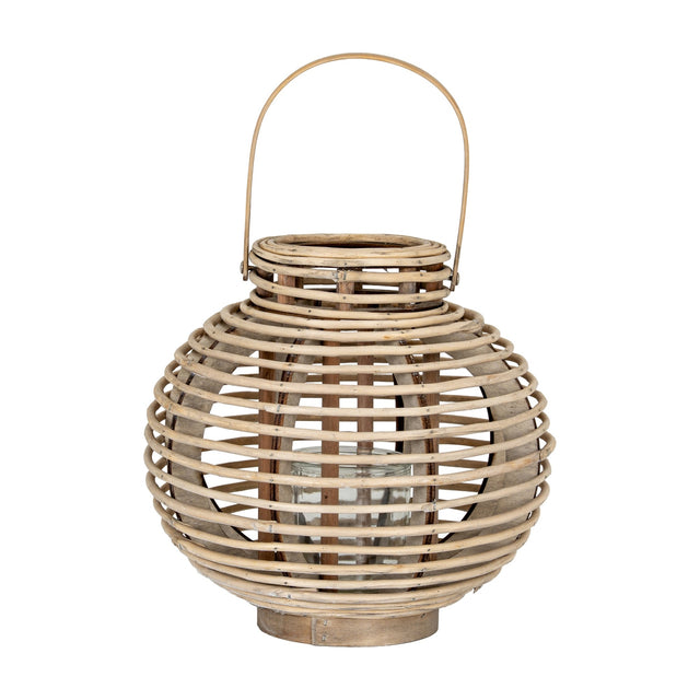 Hill Interiors large round willow lantern in warm brown with woven wicker frame, arched handle and removable glass candle holder, on a white background.