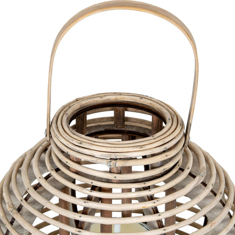 Close-up of Hill Interiors Large Round Willow Lantern in brown, showing the woven wicker dome, arched handle and removable glass candle holder inside.
