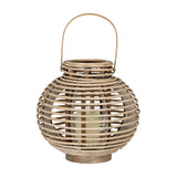Hill Interiors large round willow lantern in warm brown with woven wicker frame, arched handle and removable glass holder containing a pillar candle.