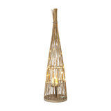 Hill Interiors large conical wicker lantern in brown with tapering woven frame, illuminated fairy lights and a lit pillar candle in a glass holder.