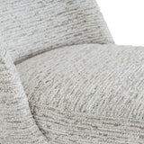 Close-up of the Hill Interiors Marlenza dining chair showing its soft white woven-textured upholstery across the curved backrest and seat.