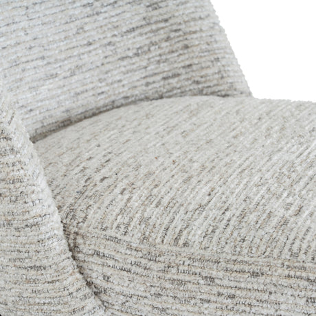 Close-up of the Hill Interiors Marlenza dining chair showing its soft white woven-textured upholstery across the curved backrest and seat.