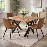 Hill Interiors Draxinby Swivel Dining Chairs in tan upholstery with ribbed backs and black metal legs, around a live-edge wood table in a bright room.