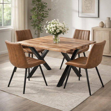 Hill Interiors Draxinby Swivel Dining Chairs in tan upholstery with ribbed backs and black metal legs, around a live-edge wood table in a bright room.