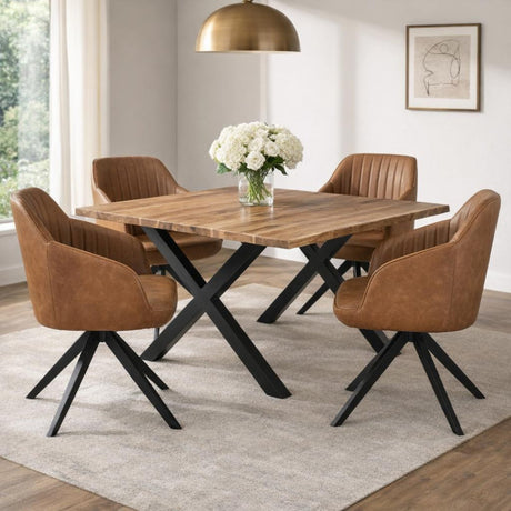 Hill Interiors Tan Metal Accent Chair with tan leather-look upholstery and black splayed legs, set with three matching chairs around a wooden dining table.