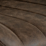 Close-up of the Hill Interiors Draxinby Swivel Dining Chair showing horizontal channel-stitched panels in warm coffee brown upholstery.