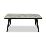 Hill Interiors rectangular dining table with a grey concrete-effect top and angled matte black metal legs, shown on a plain white background.