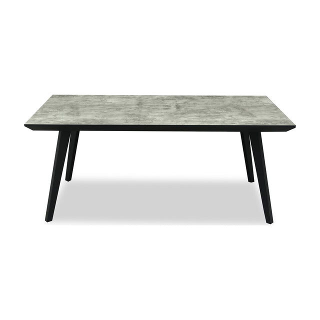 Hill Interiors rectangular dining table with a grey concrete-effect top and angled matte black metal legs, shown on a plain white background.