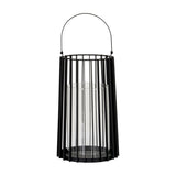 Hill Interiors large black metal lantern with vertical slatted frame, arched handle and clear glass pillar candle holder, shown on a white background.