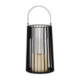 Hill Interiors large black metal lantern with vertical slatted frame, arched handle and clear glass hurricane holding a cream pillar candle.