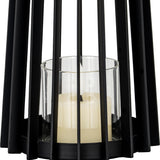 Hill Interiors small black lantern shown in close-up, with slim vertical metal bars framing a clear glass holder and pale pillar candle inside.