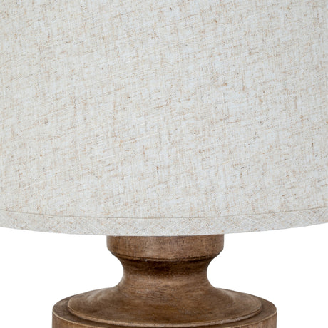 Close-up of the Hill Interiors Table Lamp with Edged Linen Shade in brown, showing the textured natural linen drum shade and turned resin base detail.