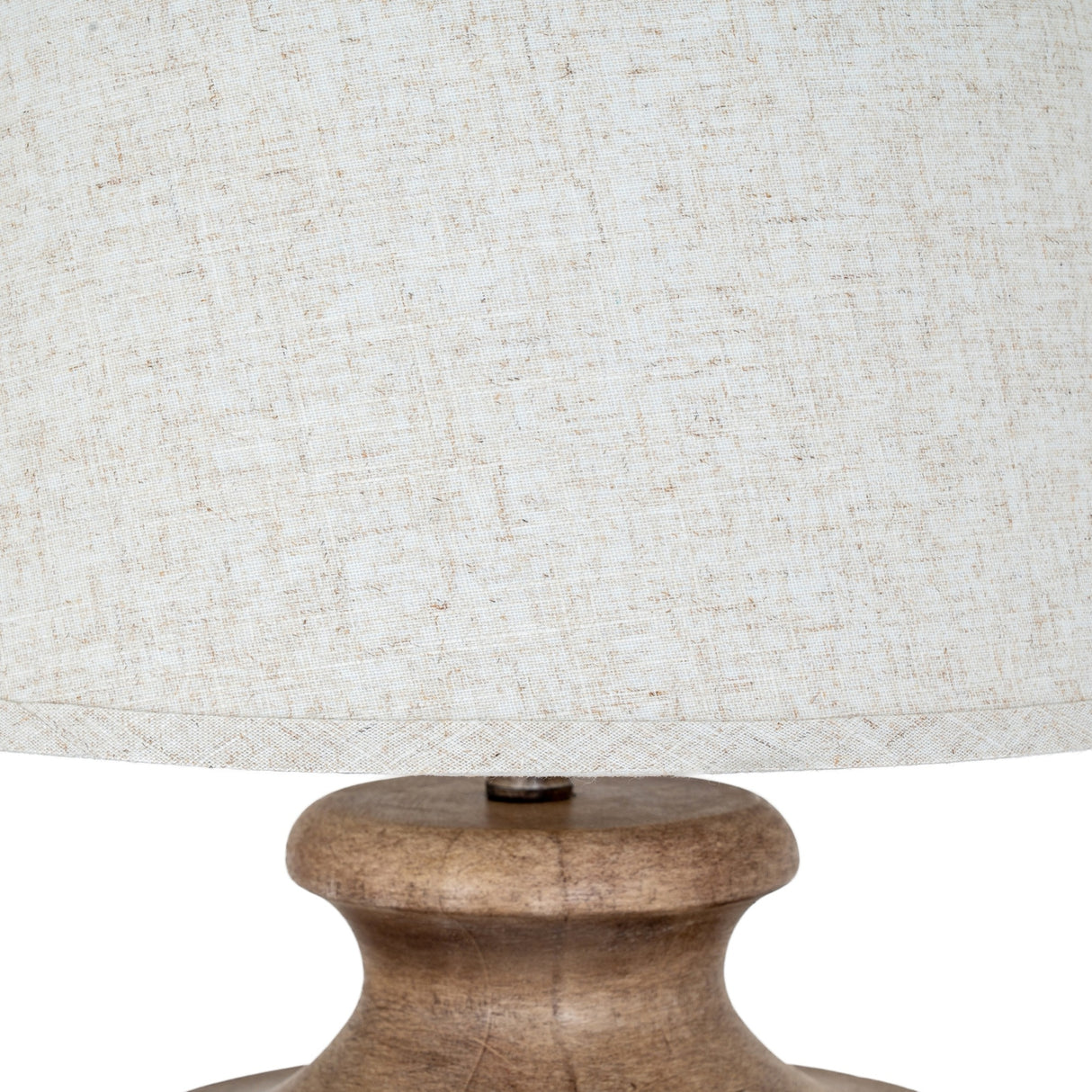 Close-up of Hill Interiors Table Lamp with Edged Linen Shade in brown, showing the sculpted resin base and cream linen drum shade against a white background.