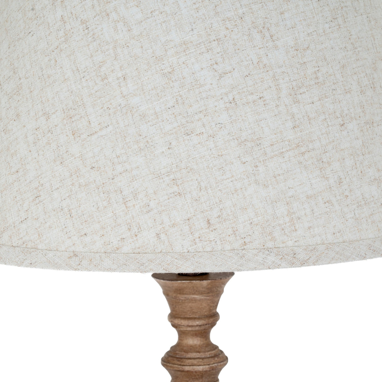Close-up of the Hill Interiors Table Lamp With Edged Linen Shade in brown, showing the neutral linen shade edging and turned resin base detail.