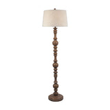 Hill Interiors Velantha floor lamp with turned brown resin baluster base and edged cream linen drum shade on a plain white background.