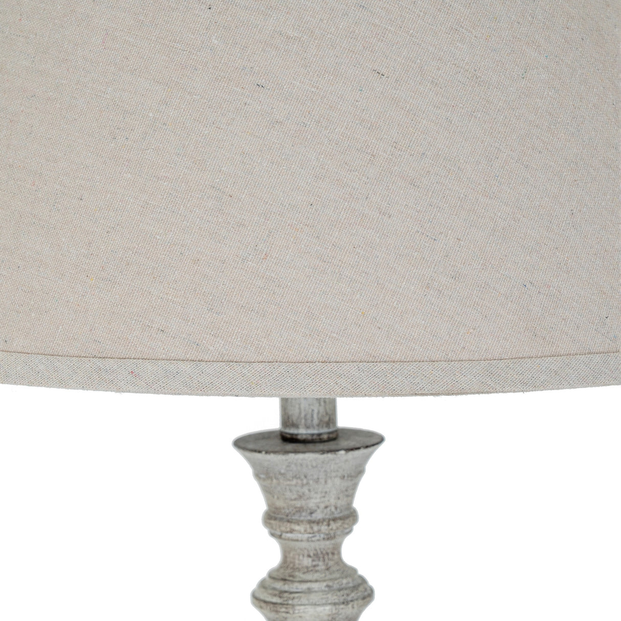 Close-up of Hill Interiors Table Lamp with Linen Shade in white, showing the moulded resin base detail and natural linen drum shade.