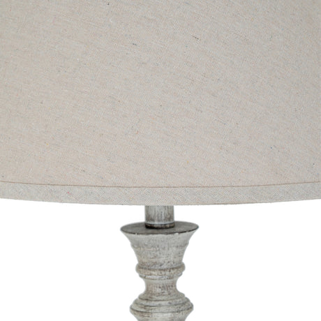 Close-up of Hill Interiors Table Lamp with Linen Shade in white, showing the moulded resin base detail and natural linen drum shade.