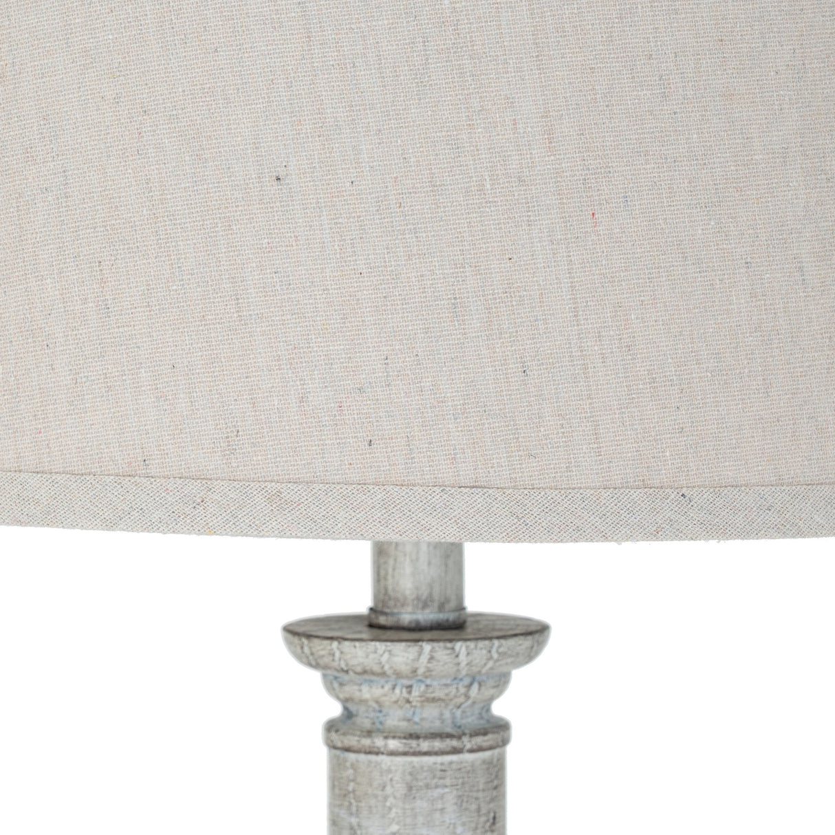 Close-up of the Hill Interiors Table Lamp with Linen Shade, showing the natural linen drum shade and distressed white moulded resin base.