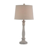 Hill Interiors Table Lamp with turned white resin base and tapered natural linen drum shade, shown on a plain white background.