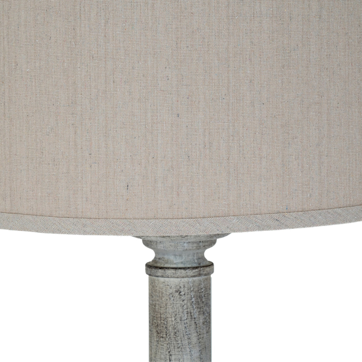 Close-up of Hill Interiors Floor Lamp with Linen Shade in white, showing the natural linen drum shade meeting the turned resin base.