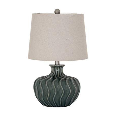 Hill Interiors ceramic table lamp with a ribbed, rounded dark green-grey glazed base and tapered natural linen shade, shown on a plain white background.