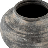 Close-up of Hill Interiors Squat Ceramic Vase in black, showing the rounded body, short neck and textured, weathered glaze against a plain background.