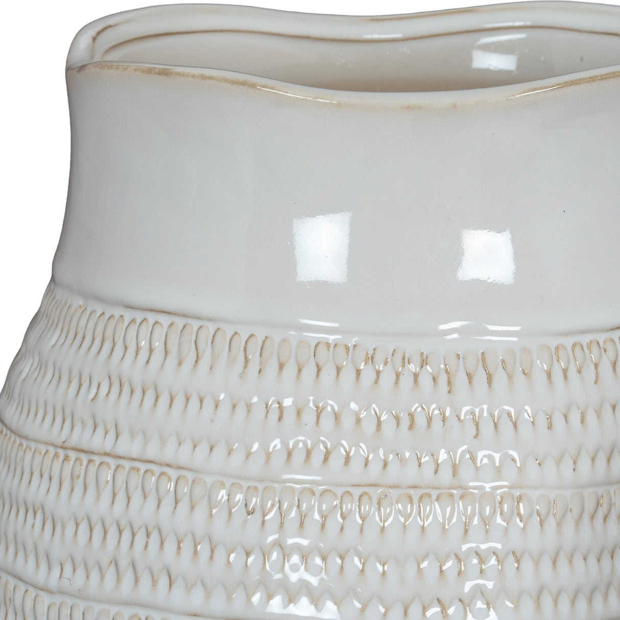Close-up of the Hill Interiors Hewn Bud Vase in white ceramic, showing its glossy glaze and textured bands of carved teardrop detailing around the base.