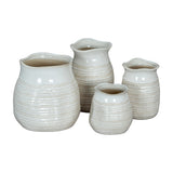 Hill Interiors Wide Hewn Ceramic Vases in white, shown in four sizes with rounded bodies, textured ribbed surfaces and wavy rims on a white background.
