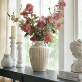 Hill Interiors Large Amphora Vase in white ceramic with a ribbed textured body, holding pink blossom stems on a console beside candle holders and a bust.