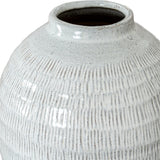 Close-up of the Hill Interiors Medium Olpe ceramic vase showing its rounded body, slim neck, and textured white finish with fine vertical striations.