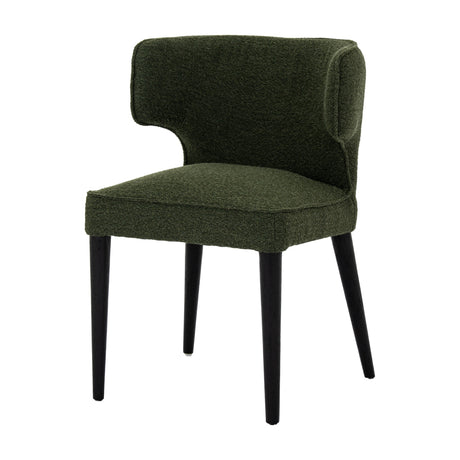 Hill Interiors Quennomer dining chair with moss green boucle upholstery, curved wingback and padded seat on tapered black wooden legs, plain white background.