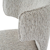 Close-up of the Hill Interiors Quennomer bar stool showing grey textured woven upholstery with subtle beige tones and curved seat edge detailing.