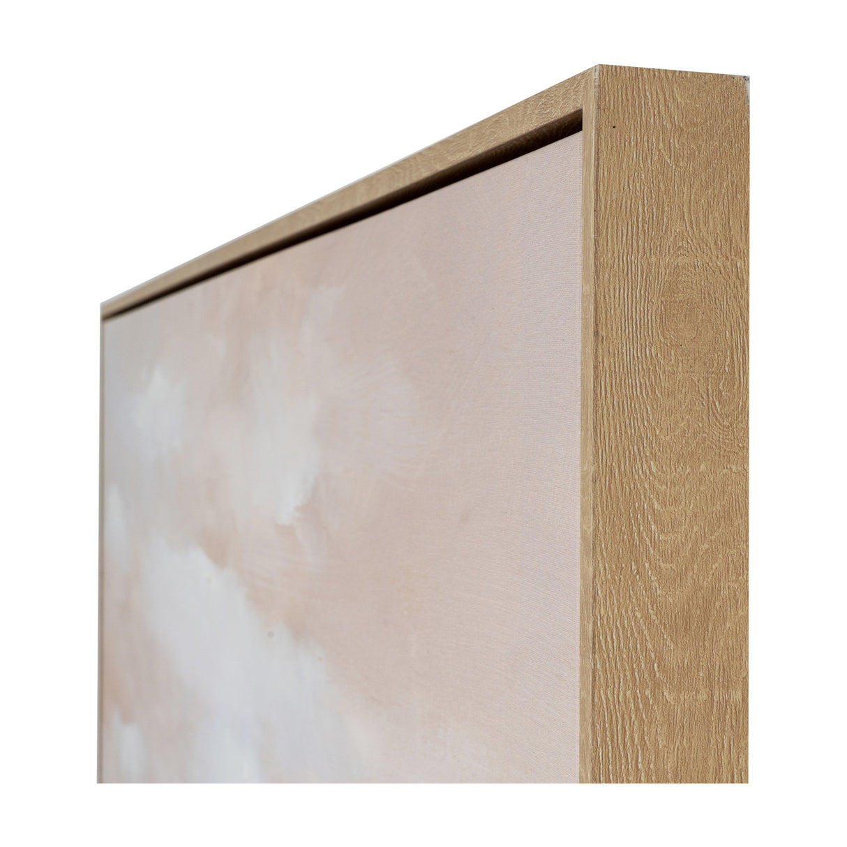 Close-up corner view of Hill Interiors hand painted canvas showing soft pink and cream brushwork within a slim light wooden frame.