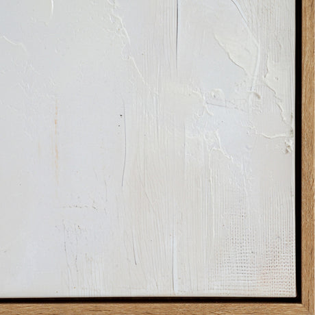 Close-up of Hill Interiors hand painted canvas showing textured white brushwork and palette knife strokes within a light wooden frame corner.