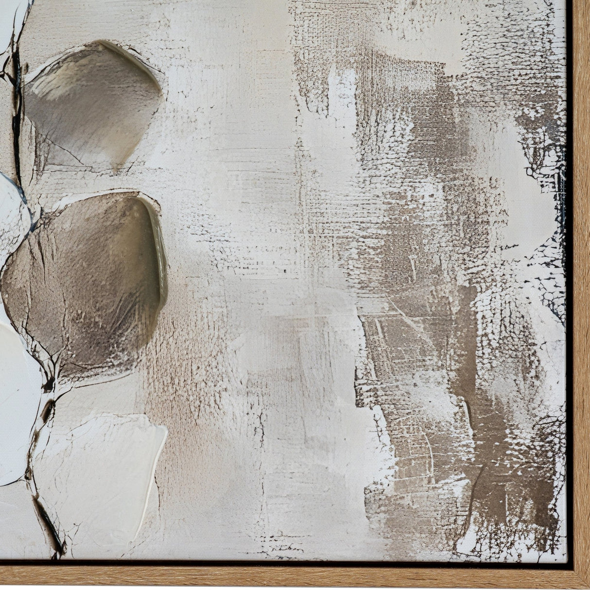 Close-up of Hill Interiors hand painted canvas wall art showing textured white, beige and brown brushwork with a wooden frame edge.