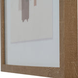 Close-up of the Hill Interiors framed wall art showing the solid wooden frame corner and part of the multicoloured painterly print inside.