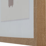 Close-up of the Hill Interiors framed wall art showing the solid wooden frame corner and the edge of the multicoloured print inside.