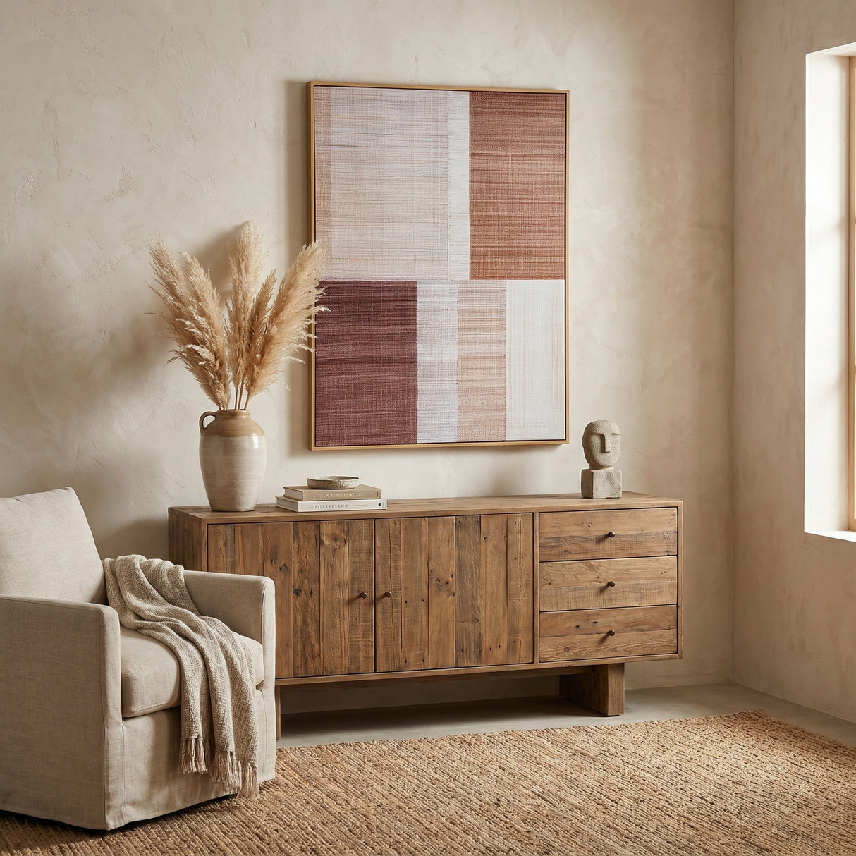Hill Interiors hand painted canvas wall art in a slim wood frame with warm multicoloured block shapes, hung above a reclaimed wood sideboard in a living room.