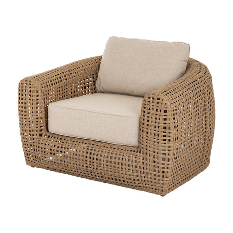 Hill Interiors Rattan Garden Lounge Chair in brown, with a wide woven frame, curved arms and beige seat and back cushions, on a white background.
