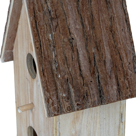Close-up of Hill Interiors Large Rustic Wooden Birdhouse in white, showing the bark-textured pitched roof, entrance hole and wooden perch.