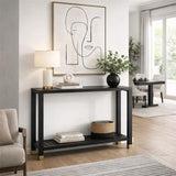 Hill Interiors Harweld black console table with slim frame and lower shelf, styled with a lamp, vase and books in a bright modern hallway.